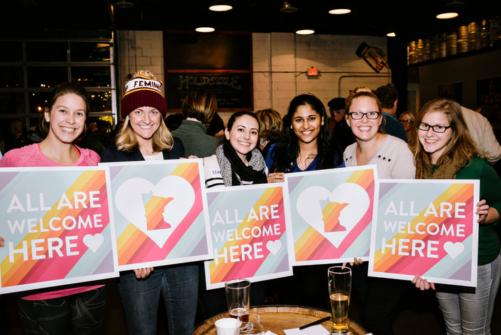 Behind The News: The story behind the All Are Welcome Here signs